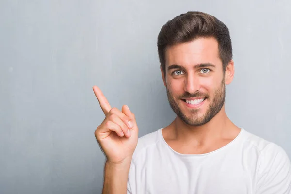 Handsome Young Man Grey Grunge Wall Very Happy Pointing Hand — Stock Photo, Image