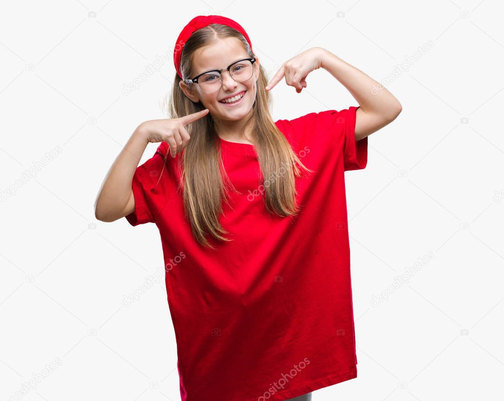 Young beautiful girl wearing glasses over isolated background smiling confident showing and pointing with fingers teeth and mouth. Health concept.