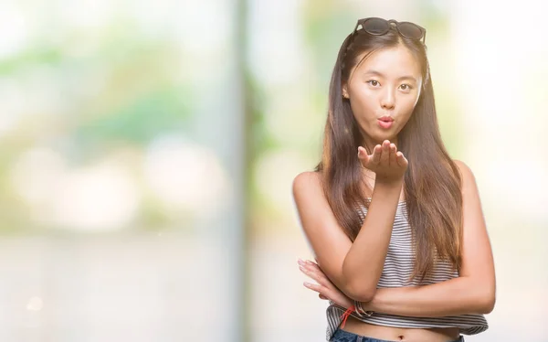 Young Asian Woman Wearing Sunglasses Isolated Background Looking Camera Blowing — Stock Photo, Image