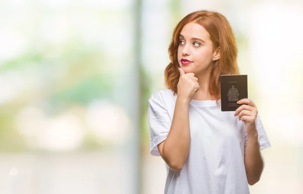 Jovem Bela Mulher Segurando Passaporte Canadá Sobre Fundo Isolado Rosto — Fotografia de Stock