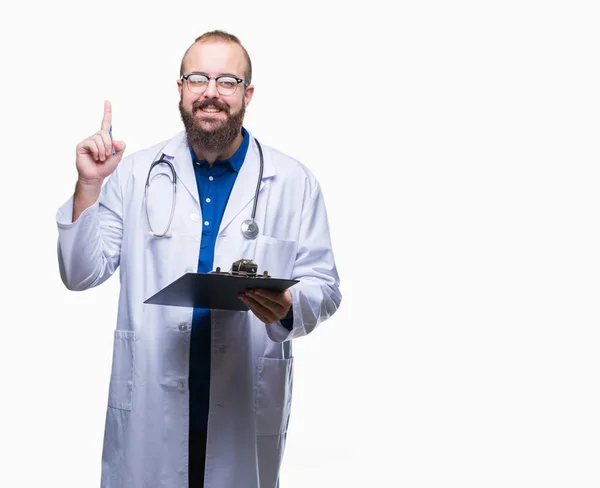Young Doctor Man Holding Clipboard Isolated Background Surprised Idea Question — Stock Photo, Image