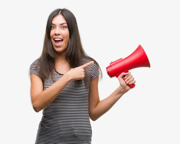 Young Hispanic Woman Holding Megaphone Very Happy Pointing Hand Finger — Stock Photo, Image