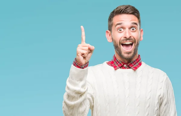 Joven Hombre Guapo Con Suéter Invierno Sobre Fondo Aislado Señalando —  Fotos de Stock