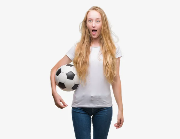 Blonde Teenager Woman Holding Soccer Football Ball Scared Shock Surprise — Stock Photo, Image