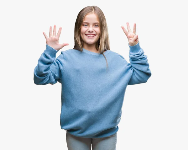 孤立した背景表示と指で上向きに美しい若い女の子着て冬セーター数 自信を持って 幸せな笑みを浮かべて — ストック写真