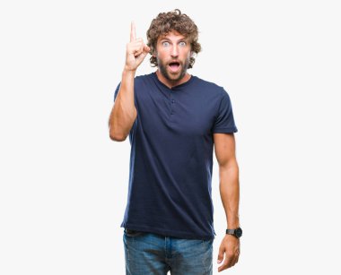 İzole arka plan başarılı fikirle parmak işaret adam yakışıklı İspanyol modeli. Çıktıktan ve mutlu. Bir numara.
