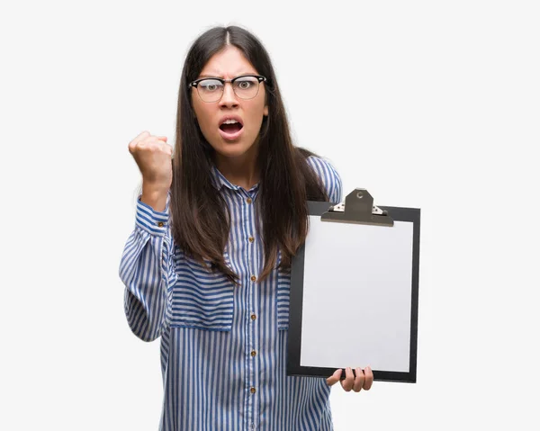 Young Hispanic Woman Holding Clipboard Annoyed Frustrated Shouting Anger Crazy — Stock Photo, Image