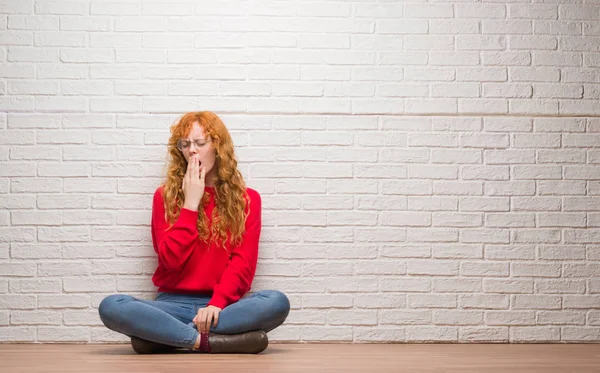 Young Redhead Woman Sitting Brick Wall Bored Yawning Tired Covering — Stock Photo, Image