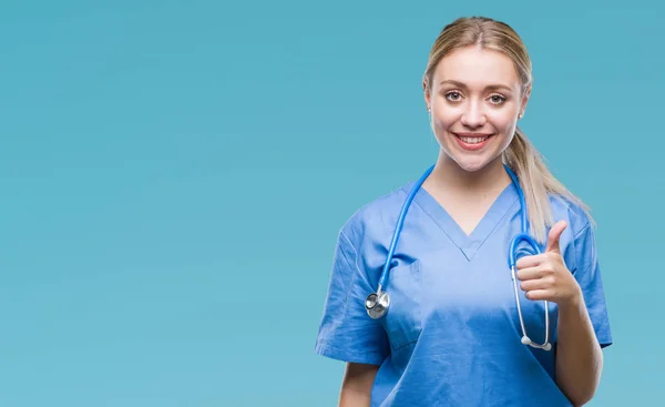 Young Blonde Surgeon Doctor Woman Isolated Background Doing Happy Thumbs — Stock Photo, Image