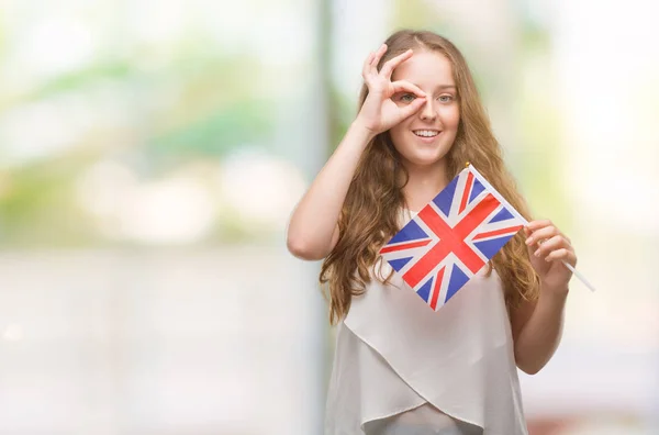 Mujer Rubia Joven Sosteniendo Bandera Del Reino Unido Con Cara —  Fotos de Stock