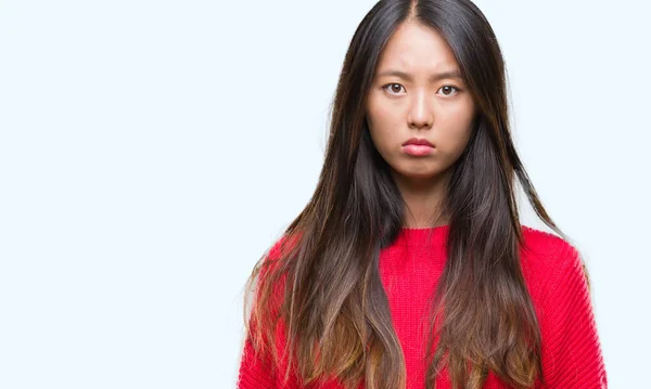 Junge Asiatische Frau Winterpullover Über Isoliertem Hintergrund Skeptisch Und Nervös — Stockfoto