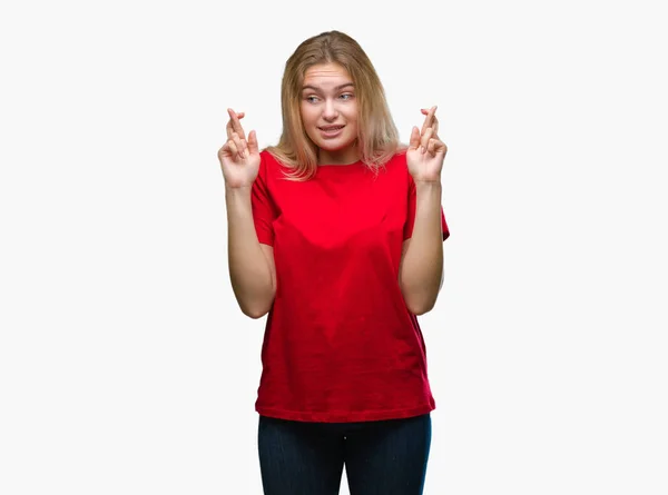 Young Caucasian Woman Isolated Background Smiling Crossing Fingers Hope Eyes — Stock Photo, Image