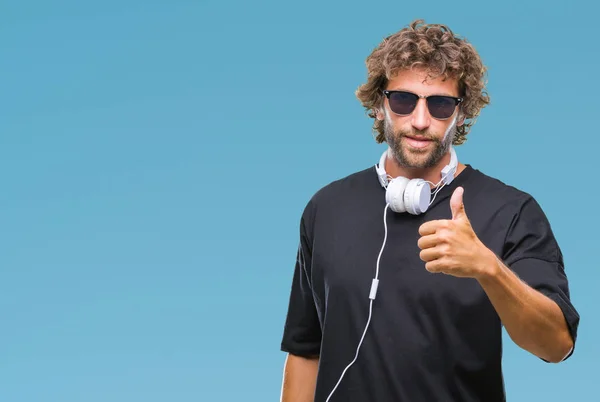 Handsome Hispanic Man Listening Music Wearing Headphones Isolated Background Doing — Stock Photo, Image