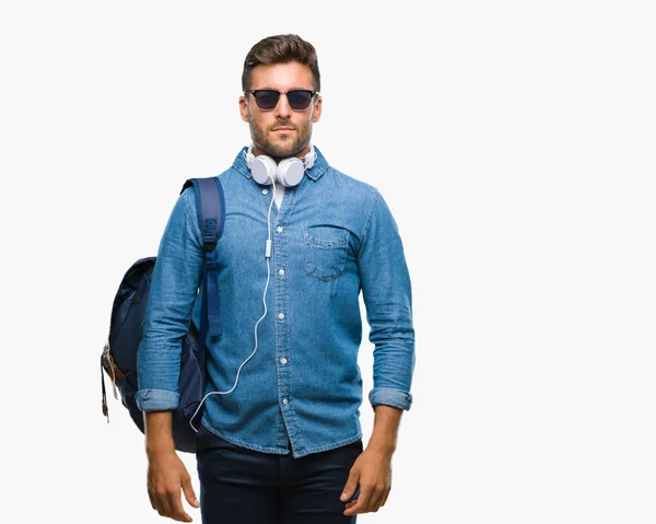 Young Handsome Tourist Man Wearing Headphones Backpack Isolated Background Serious — Stock Photo, Image