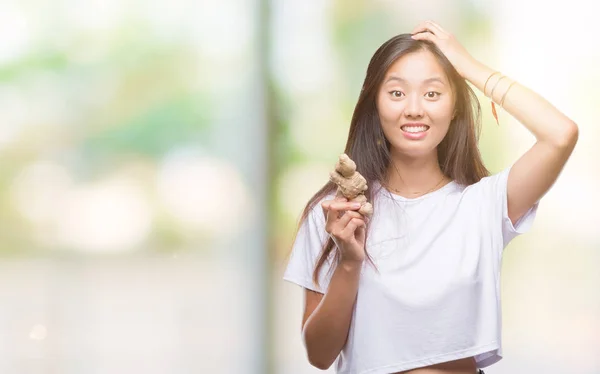 Young Asian Woman Holding Fresh Organic Isolated Background Stressed Hand — Stock Photo, Image