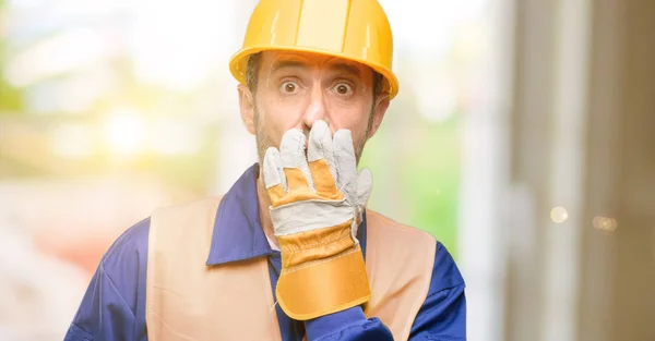 Senior Engineer Man Construction Worker Covers Mouth Shock Looks Shy — Stock Photo, Image