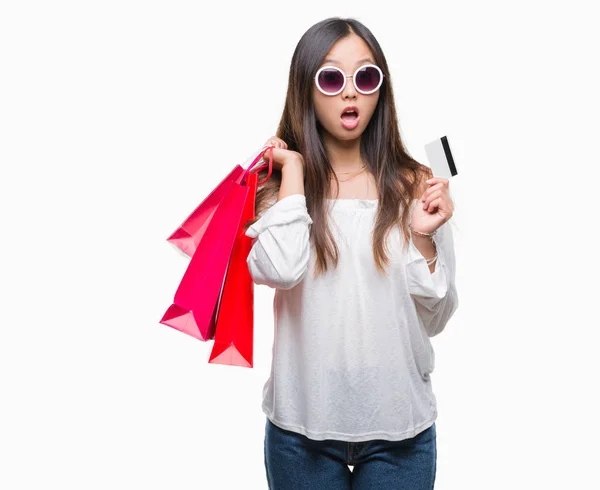 Young Asian Woman Holding Shopping Bags Sales Isolated Background Scared — Stock Photo, Image