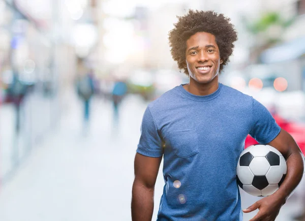 Hombre Afroamericano Sosteniendo Pelota Fútbol Sobre Fondo Aislado Con Una —  Fotos de Stock