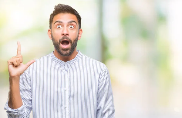 Erwachsener Hispanischer Mann Mit Isoliertem Hintergrund Der Mit Erhobenem Zeigefinger — Stockfoto