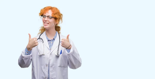 Young Redhead Woman Wearing Doctor Uniform Success Sign Doing Positive — Stock Photo, Image