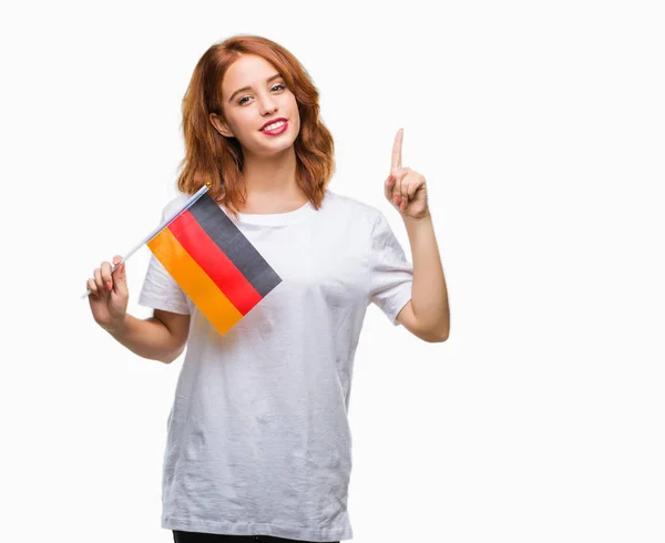 Młoda Kobieta Piękne Gospodarstwa Banderą Niemiec Białym Tle Zaskoczony Pomysłu — Zdjęcie stockowe