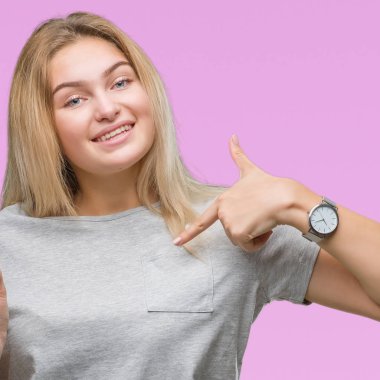 Derecesi sürpriz yüz işaret parmağı kendini izole arka plan üzerinde tutan genç beyaz kadın