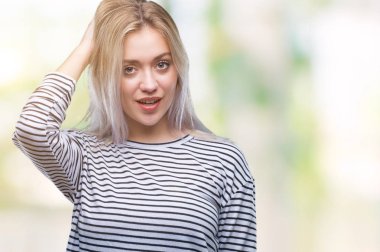 Sarışın genç kadın izole arka plan üzerinde yanıltır ve soru hakkında merak ediyorum. Şüphe, kafasına el ile düşünme ile belirsiz. Dalgın kavramı.