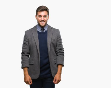 Genç yakışıklı iş adamı yüzünde mutlu ve güzel bir gülümseme ile izole arka plan üzerinde. Şanslı kişi.