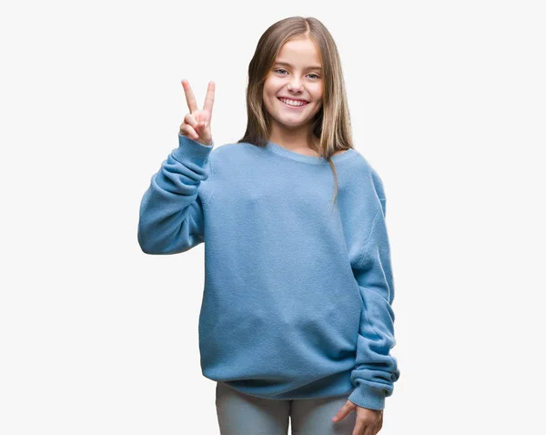 孤立した背景表示と指で上向きに美しい若い女の子着て冬セーター数は自信を持って 幸せな笑みを浮かべている間 — ストック写真
