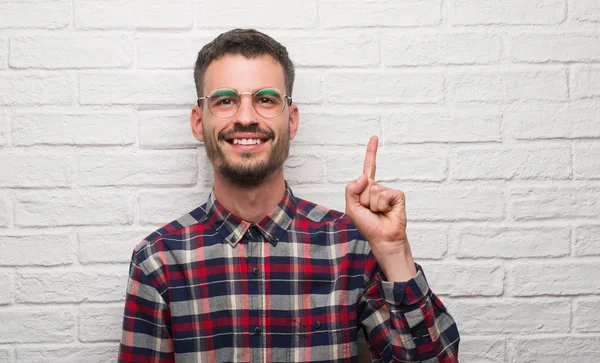 Young Adult Man Standing White Brick Wall Surprised Idea Question — Stock Photo, Image