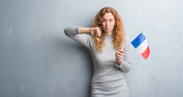 Young Redhead Woman Grey Grunge Wall Holding Flag France Angry — Stock Photo, Image