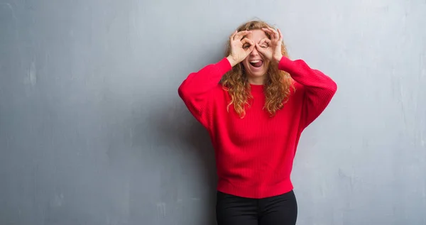 Young Redhead Woman Grey Grunge Wall Wearing Red Sweater Doing — Stock Photo, Image