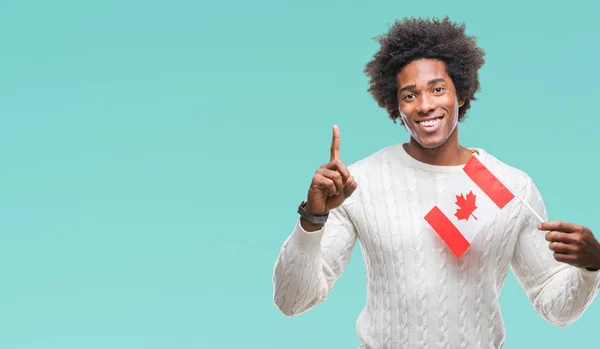 Afroamerikanischer Mann Flagge Von Kanada Über Isoliertem Hintergrund Überrascht Mit — Stockfoto