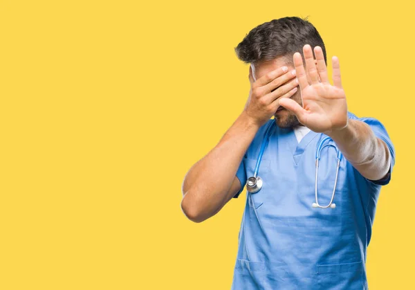 Young Handsome Doctor Surgeon Man Isolated Background Covering Eyes Hands — Stock Photo, Image
