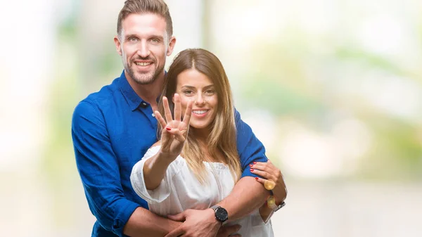 Young Couple Love Isolated Background Showing Pointing Fingers Number Four — Stock Photo, Image