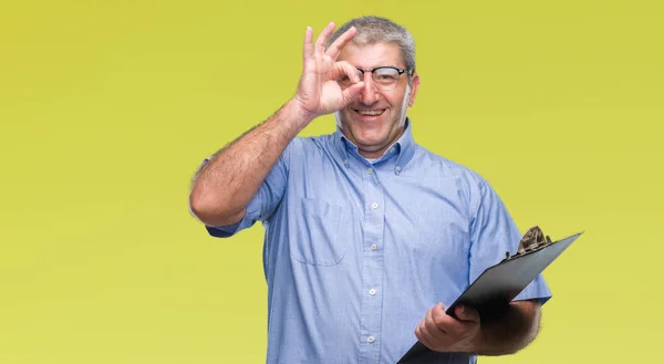 Handsome Senior Inspector Man Holding Clipboard Isolated Background Happy Face — Stock Photo, Image