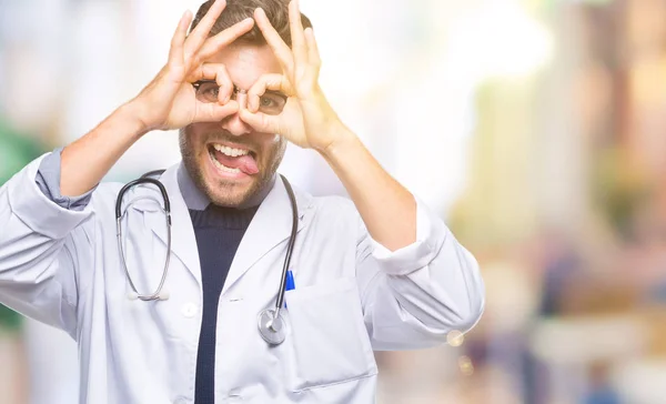 Young Handsome Doctor Man Isolated Background Doing Gesture Binoculars Sticking — Stock Photo, Image