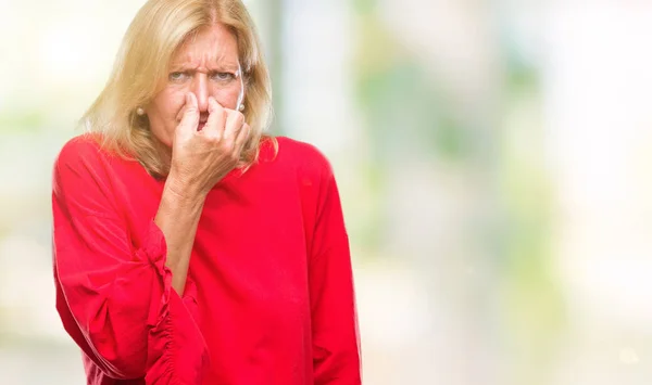Middle Age Blonde Woman Isolated Background Smelling Something Stinky Disgusting — Stock Photo, Image