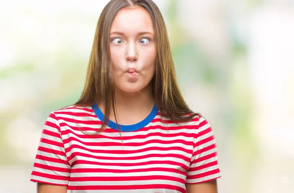 Joven Mujer Hermosa Caucásica Sobre Fondo Aislado Haciendo Cara Pez —  Fotos de Stock