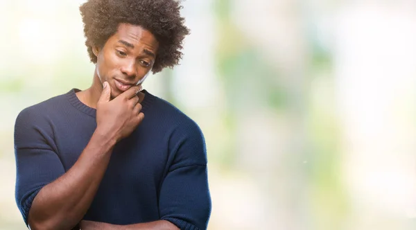 Afro american man over isolated background thinking looking tired and bored with depression problems with crossed arms.