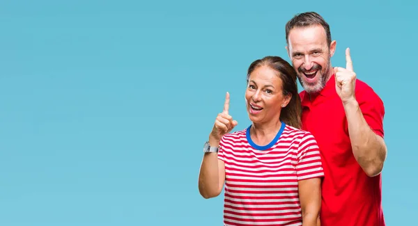 Middle Age Hispanic Couple Love Isolated Background Pointing Finger Successful — Stock Photo, Image