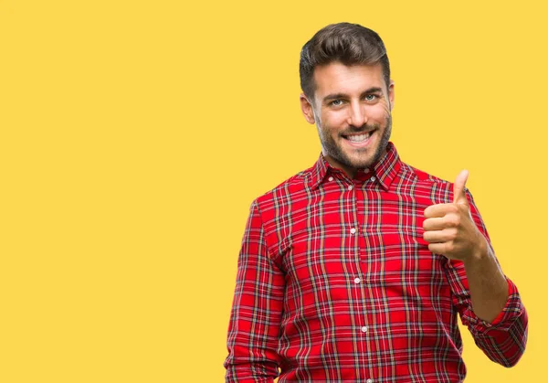 Joven Hombre Guapo Sobre Fondo Aislado Haciendo Pulgares Felices Gesto —  Fotos de Stock