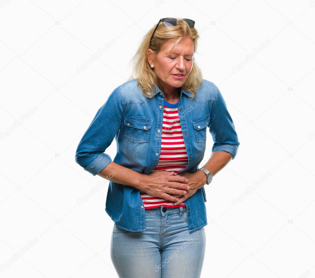 Middle age blonde woman over isolated background with hand on stomach because nausea, painful disease feeling unwell. Ache concept.