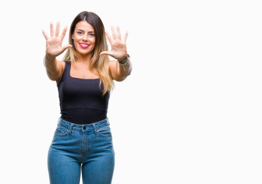 Genç güzel kadın gösterilen ve parmakları ile işaret izole arka plan yüzünden kendinden emin ve mutlu gülümseyerek süre on numara.
