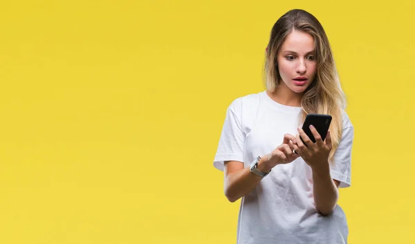 Young Beautiful Blonde Woman Using Smartphone Isolated Background Scared Shock — Stock Photo, Image