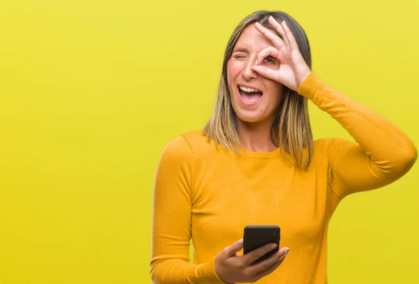 Young Beautiful Woman Sending Message Using Smartphone Isolated Background Happy — Stock Photo, Image