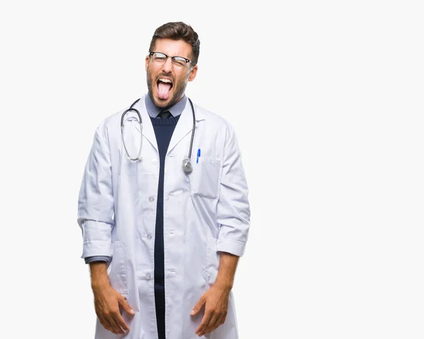 Młody Przystojny Lekarz Mężczyzna Białym Tle Trzymanie Języka Out Wyrażenie — Zdjęcie stockowe