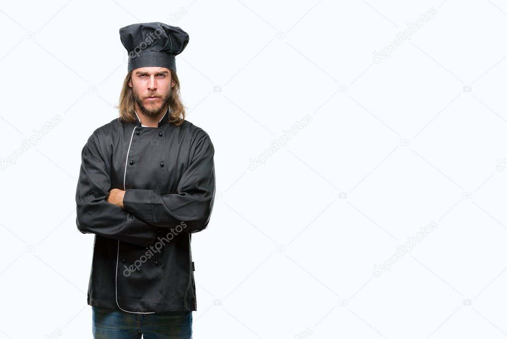 Young handsome cook man with long hair over isolated background skeptic and nervous, disapproving expression on face with crossed arms. Negative person.