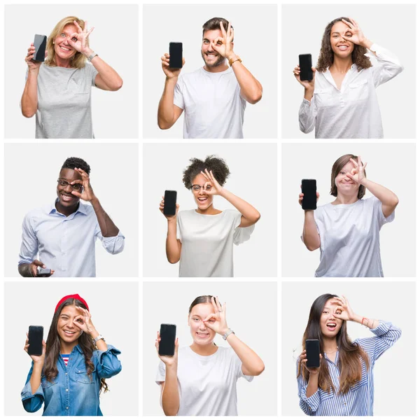 Collage of group of young people showing screen of smartphone over isolated background with happy face smiling doing ok sign with hand on eye looking through fingers