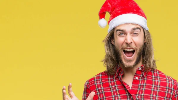 Junger Gutaussehender Mann Mit Langen Haaren Weihnachtsmannmütze Über Isoliertem Hintergrund — Stockfoto